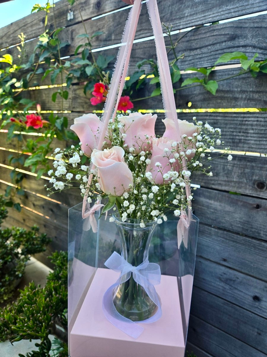 Rose vase in a hanging clear gift bag