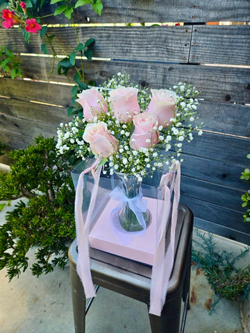 Rose vase in a hanging clear gift bag