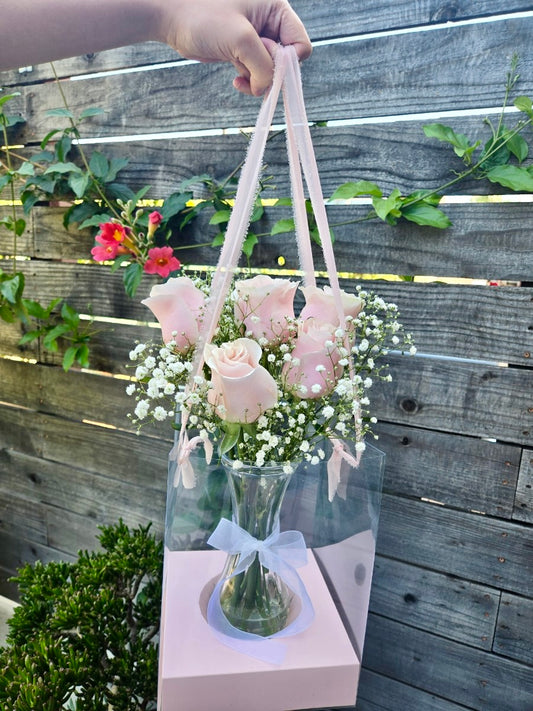 Rose vase in a hanging clear gift bag